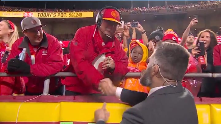 Jason Kelce shakes hands with a Kansas City Chiefs fan dressed as Andy Reid. 