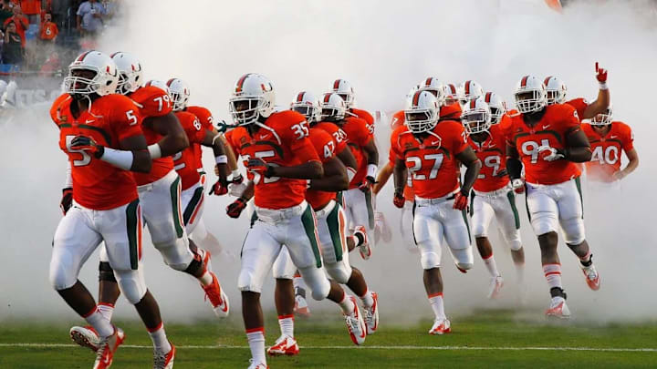 Miami running out of the tunnel before a game.