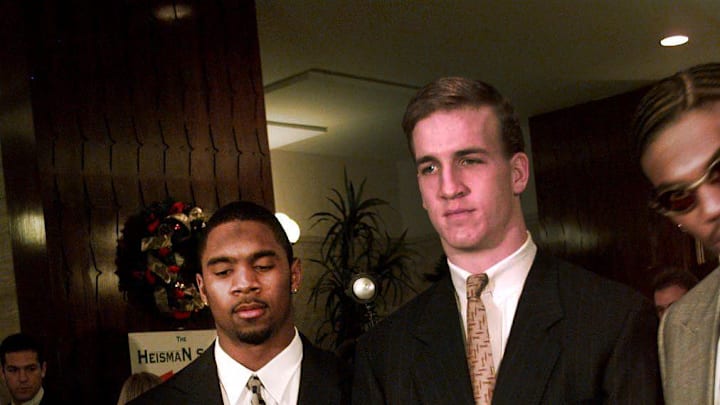 Charles Woodson and Peyton Manning pose with the Heisman Trophy at the Downtown Athletic Club Saturday night before the actual award was made. 1997.
Peyton Manning At Heisman 1997 Charles Woodson and Peyton Manning pose with the Heisman Trophy at the Downtown Athletic Club Saturday night before the actual award was made. 1997.
Peyton Manning At Heisman 1997