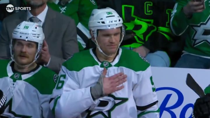 Dallas Stars winger Mikko Rantanen pats his chest as he is cheered by Colorado Avalanche fans.