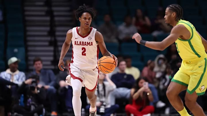 Alabama guard Aden Holloway (2) dribbles the ball against Oregon at MGM Grand Garden Arena in Las Vegas, NV on Saturday, Nov 30, 2024. 