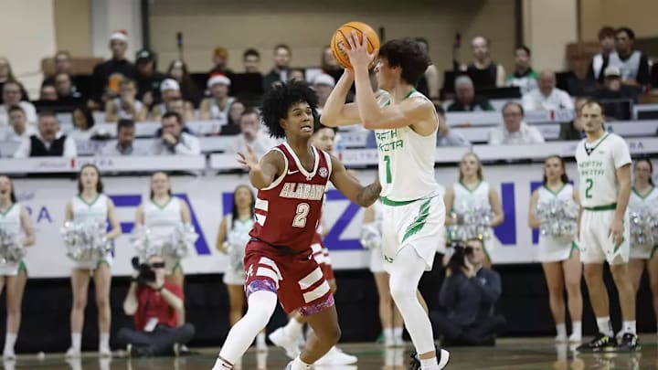 Alabama guard Aden Holloway (2) plays defense against North Dakota at Betty Engelstad Sioux Center in Grand Forks, ND on Wednesday, Dec 18, 2024.