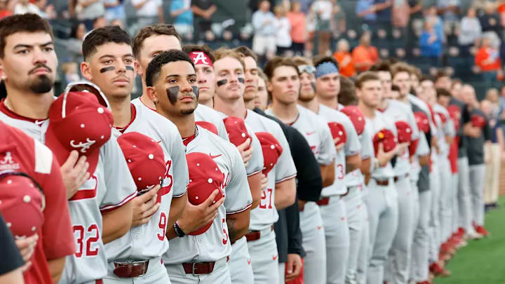 Alabama baseball players during the national anthem. Alabama baseball players during the national anthem.