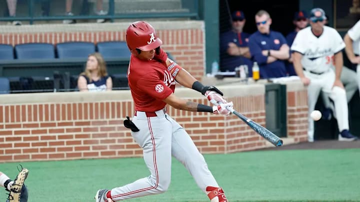 Alabama shortstop Justin Lebron (1) batting against Auburn.