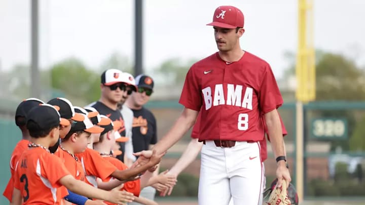 Alabama relief pitcher Tyler Fay (8) before a game.