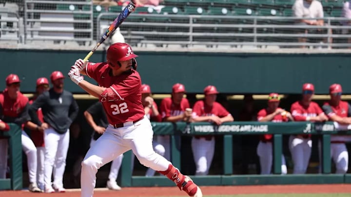 Alabama third baseman Jason Torres (32).