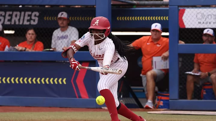 Alabama softball player Kristen White (3) hits the ball against Florida at Devon Park in Oklahoma City, OK on Sunday, Jun 2, 2024.