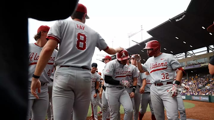 Alabama baseball players celebrate. Alabama baseball players celebrate.