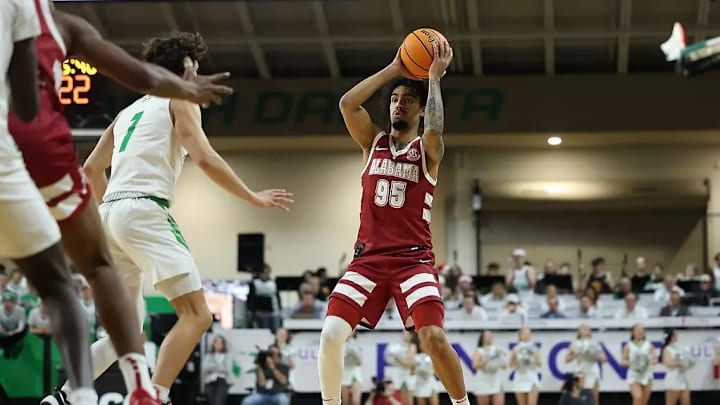 Alabama guard Houston Mallette (95) looks to pass the ball against North Dakota at Betty Engelstad Sioux Center in Grand Forks, ND on Wednesday, Dec 18, 2024.