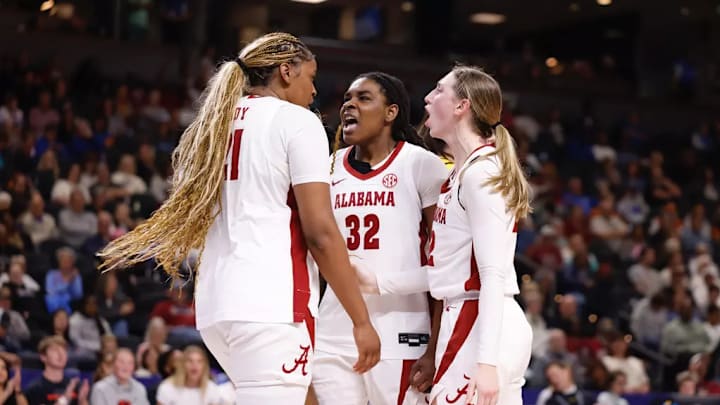 Alabama Forward Essence Cody (21), Alabama Forward Alancia Ramsey, and Alabama Guard Karly Weathers (22) celebrate during the First Round of the SEC Tournament at Bon Secours Wellness Arena in Greenville, South Carolina on Wednesday, Mar 4, 2026.