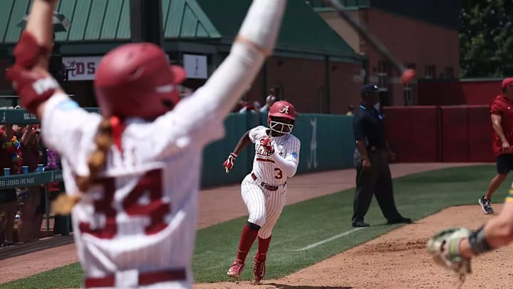 Alabama softball player Marlie Giles (13) celebrates while Alabama softball player Kristen White (3) runs home against Southeastern at Rhoads Stadium in Tuscaloosa, AL on Sunday, May 19, 2024 Alabama softball player Marlie Giles (13) celebrates while Alabama softball player Kristen White (3) runs home against Southeastern at Rhoads Stadium in Tuscaloosa, AL on Sunday, May 19, 2024