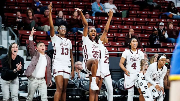 Mississippi State Center Rocío Jiménez (#13) and Mississippi State Forward Favour Nwaedozi (#25) during the ACC/SEC Challenge game between the Pittsburgh Panthers and the Mississippi State Bulldogs at Humphrey Coliseum in Starkville, MS.