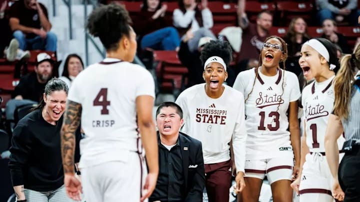 Mississippi State Guard Trayanna Crisp (#4), Mississippi State Strength and Conditioning Coach Kaiti Jones, Mississippi State Director of Women's Basketball Recruiting Operations Jimmy Yu, Mississippi State Center Faith Wylder (#23) and Mississippi State Center Rocío Jiménez (#13) during the game between the Auburn Tigers and the Mississippi State Bulldogs at Humphrey Coliseum in Starkville, MS.