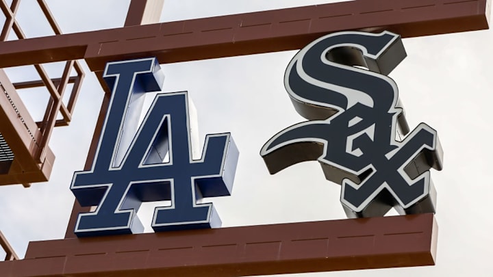 Logos for the Los Angeles Dodgers and Chicago White Sox on display at their Spring Training stadium at Camelback Ranch.