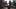 Hunter Thompson with a gun wearing a hat