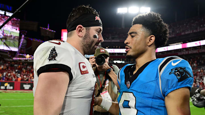 TAMPA, FLORIDA - DECEMBER 03: Baker Mayfield #6 of the Tampa Bay Buccaneers and Bryce Young #9 of the Carolina Panthers meet on the field after their game at Raymond James Stadium on December 03, 2023 in Tampa, Florida.