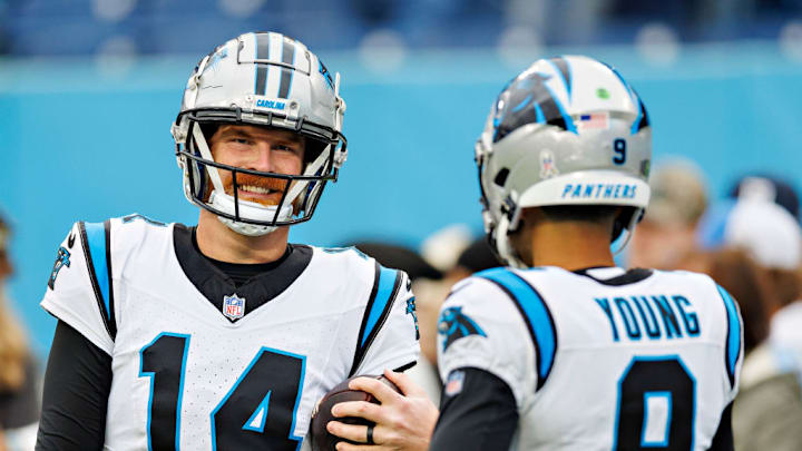 NASHVILLE, TENNESSEE - NOVEMBER 26: Andy Dalton #14 and Bryce Young #9 of the Carolina Panthers warm up before the game against the Tennessee Titans at Nissan Stadium on November 26, 2023 in Nashville, Tennessee. The Titans defeated the Panthers 17-10.