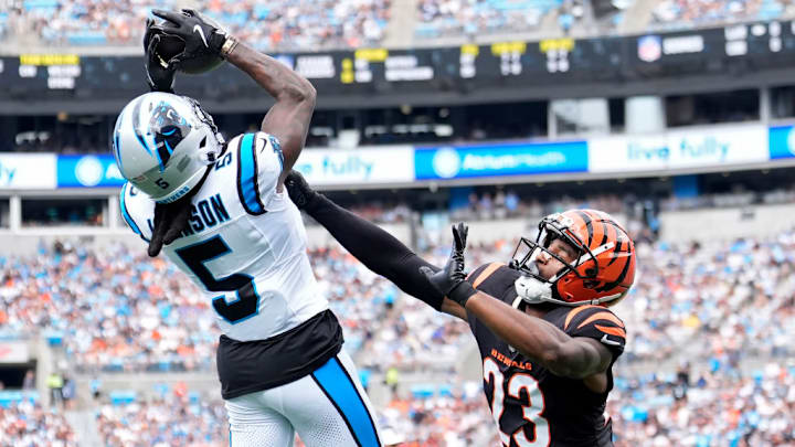 CHARLOTTE, NORTH CAROLINA - SEPTEMBER 29: Dax Hill #23 of the Cincinnati Bengals defends a pass intended for Diontae Johnson #5 of the Carolina Panthers during the first quarter at Bank of America Stadium on September 29, 2024 in Charlotte, North Carolina. 