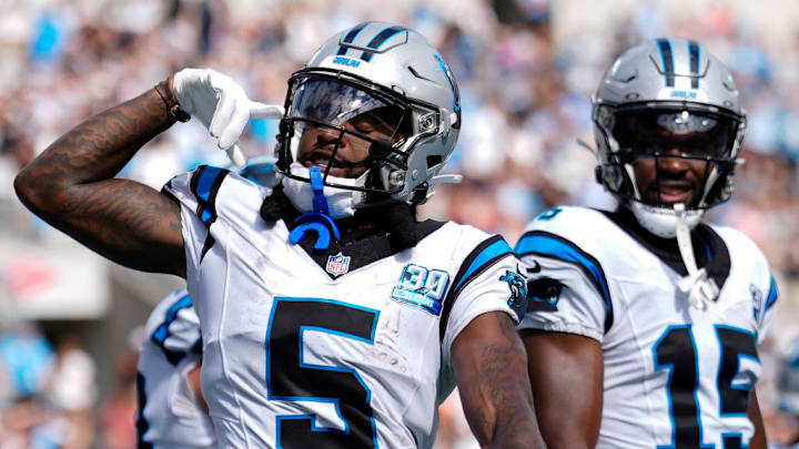 CHARLOTTE, NORTH CAROLINA - SEPTEMBER 29: Diontae Johnson #5 of the Carolina Panthers celebrates after scoring a receiving touchdown against the Cincinnati Bengals during the third quarter at Bank of America Stadium on September 29, 2024 in Charlotte, North Carolina.