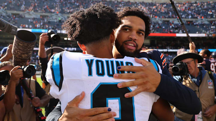 CHICAGO, ILLINOIS - OCTOBER 06: Bryce Young #9 of the Carolina Panthers and Caleb Williams #18 of the Chicago Bears embrace after the game at Soldier Field on October 06, 2024 in Chicago, Illinois.
