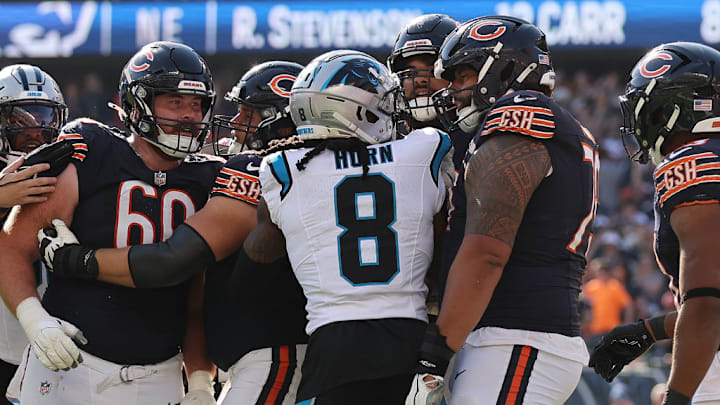 CHICAGO, ILLINOIS - OCTOBER 06: Jaycee Horn #8 of the Carolina Panthers and Matt Pryor #79 of the Chicago Bears are involved in a altercation during the fourth quarter at Soldier Field on October 06, 2024 in Chicago, Illinois.
