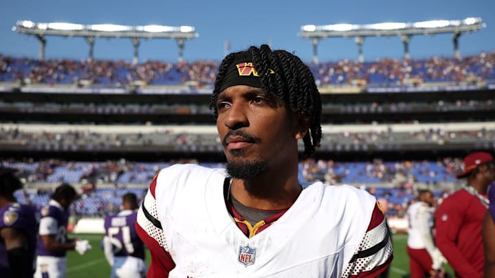BALTIMORE, MARYLAND - OCTOBER 13: Jayden Daniels #5 of the Washington Commanders walks off the field after their 23-30 loss to the Baltimore Ravens at M&T Bank Stadium on October 13, 2024 in Baltimore, Maryland.
