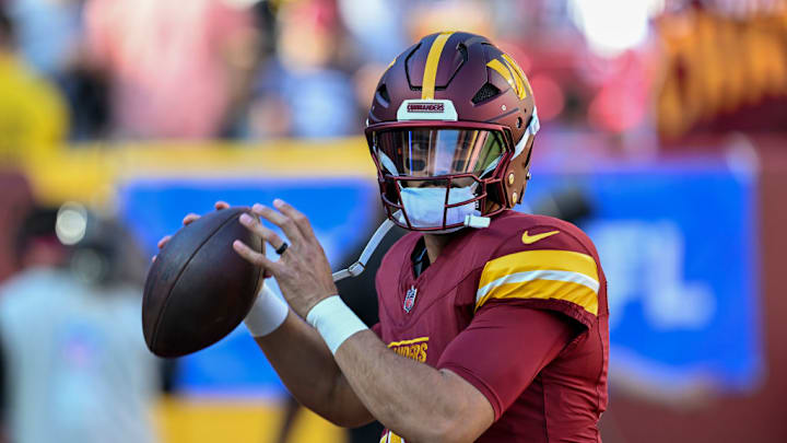 LANDOVER, MARYLAND - OCTOBER 20: Marcus Mariota #18 of the Washington Commanders warms up prior to the game against the Carolina Panthers at FedExField on October 20, 2024 in Landover, Maryland.
