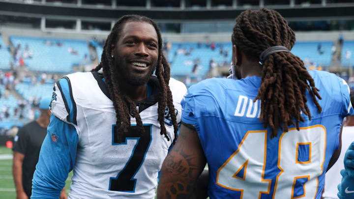 CHARLOTTE, NORTH CAROLINA - SEPTEMBER 15: Jadeveon Clowney #7 of the Carolina Panthers and Bud Dupree #48 of the Los Angeles Chargers embrace after a game at Bank of America Stadium on September 15, 2024 in Charlotte, North Carolina. The Chargers defeated the Panthers 26-3. CHARLOTTE, NORTH CAROLINA - SEPTEMBER 15: Jadeveon Clowney #7 of the Carolina Panthers and Bud Dupree #48 of the Los Angeles Chargers embrace after a game at Bank of America Stadium on September 15, 2024 in Charlotte, North Carolina. The Chargers defeated the Panthers 26-3.