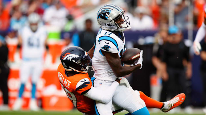 DENVER, CO - OCTOBER 27: Cornerback Levi Wallace #39 of the Denver Broncos tackles Wide receiver Xavier Legette #17 of the Carolina Panthers during the second quarter at Empower Field at Mile High on October 27, 2024 in Denver, Colorado.