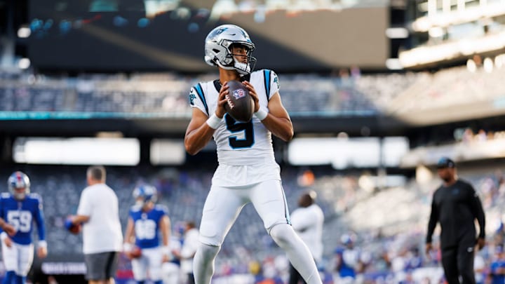 EAST RUTHERFORD, NEW JERSEY - AUGUST 18: Bryce Young #9 of the Carolina Panthers drops back and looks to throw a pass during pregame warmups prior to an NFL preseason football game against the New York Giants at MetLife Stadium on August 18, 2023 in East Rutherford, New Jersey.