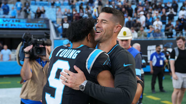 CHARLOTTE, NORTH CAROLINA - NOVEMBER 03: Head coach Dave Canales and Bryce Young #9 of the Carolina Panthers embrace after a win over the New Orleans Saints at Bank of America Stadium on November 03, 2024 in Charlotte, North Carolina. 
