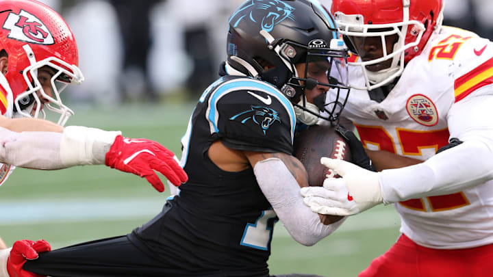 CHARLOTTE, NC - NOVEMBER 24: Carolina Panthers wide receiver Deven Thompkins (13) is tackled by Kansas City Chiefs safety Chamarri Conner (27) during an NFL football game between the Kansas City Chiefs and the Carolina Panthers on November 24, 2024 at Bank of America Stadium in Charlotte, N.C.