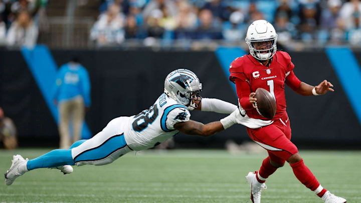 CHARLOTTE, NORTH CAROLINA - OCTOBER 02: Cornerback Myles Hartsfield #38 of the Carolina Panthers attempts to tackle quarterback #1 of the Arizona Cardinals during the second half of their game at Bank of America Stadium on October 02, 2022 in Charlotte, North Carolina.