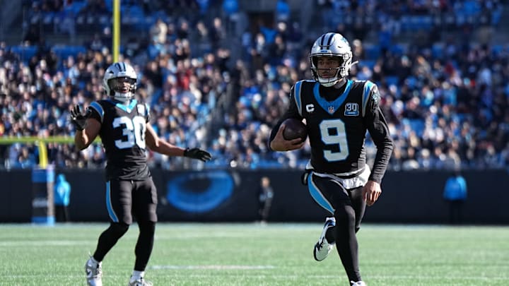 CHARLOTTE, NORTH CAROLINA - DECEMBER 22: Bryce Young #9 of the Carolina Panthers rushes for a touchdown against the Arizona Cardinals during the second quarter at Bank of America Stadium on December 22, 2024 in Charlotte, North Carolina. 