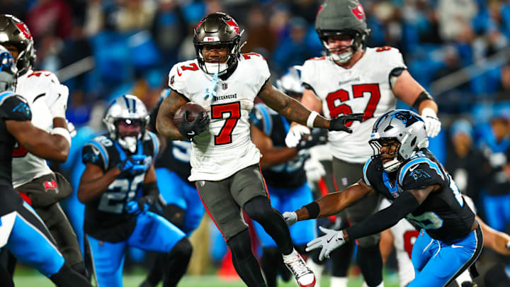 CHARLOTTE, NC - DECEMBER 01: Bucky Irving #7 of the Tampa Bay Buccaneers runs the ball during the second half of a football game against the Carolina Panthers at Bank of America Stadium on December 1, 2024 in Charlotte, North Carolina. 