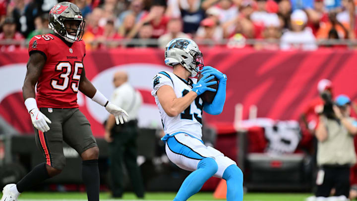 TAMPA, FLORIDA - DECEMBER 29: Adam Thielen #19 of the Carolina Panthers catches a pass for a touchdown in the first quarter against the Tampa Bay Buccaneers at Raymond James Stadium on December 29, 2024 in Tampa, Florida.
