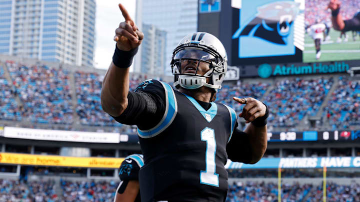 CHARLOTTE, NORTH CAROLINA - DECEMBER 26: Cam Newton #1 of the Carolina Panthers reacts after running for a first down during the first half in the game against the Tampa Bay Buccaneers at Bank of America Stadium on December 26, 2021 in Charlotte, North Carolina. CHARLOTTE, NORTH CAROLINA - DECEMBER 26: Cam Newton #1 of the Carolina Panthers reacts after running for a first down during the first half in the game against the Tampa Bay Buccaneers at Bank of America Stadium on December 26, 2021 in Charlotte, North Carolina.