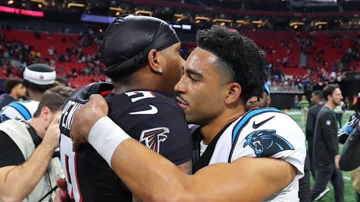 ATLANTA, GEORGIA - JANUARY 05: Michael Penix Jr. #9 of the Atlanta Falcons hugs Bryce Young #9 of the Carolina Panthers after the game at Mercedes-Benz Stadium on January 05, 2025 in Atlanta, Georgia. 