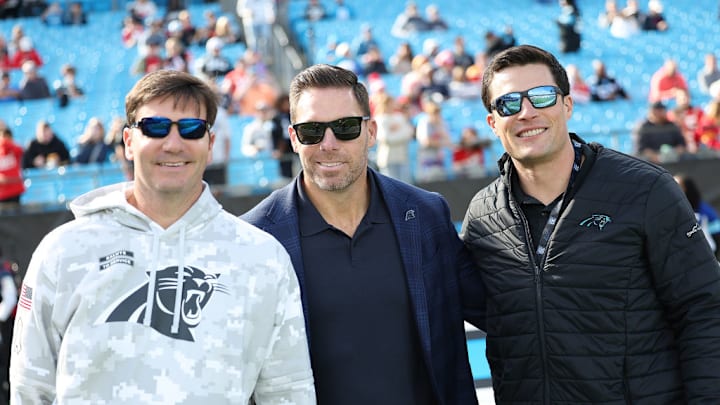 CHARLOTTE, NC - NOVEMBER 24: Panthers legends, Jake Delhome, Dan Morgan and Luke Kuechly during an NFL football game between the Kansas City Chiefs and the Carolina Panthers on November 24, 2024 at Bank of America Stadium in Charlotte, N.C.