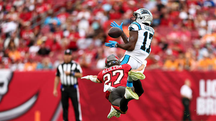 TAMPA, FLORIDA - DECEMBER 29: Xavier Legette #17 of the Carolina Panthers catches a pass as Zyon McCollum #27 of the Tampa Bay Buccaneers defends during the first half of an NFL football game at Raymond James Stadium on December 29, 2024 in Tampa, Florida.