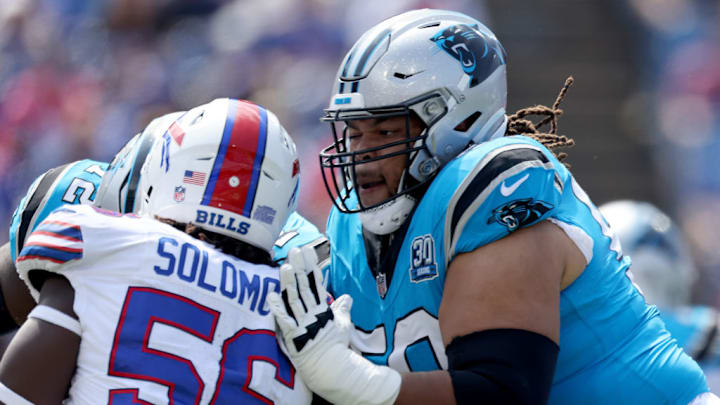 ORCHARD PARK, NEW YORK - AUGUST 24: Robert Hunt #50 of the Carolina Panthers blocks Javon Solomon #56 of the Buffalo Bills during the first quarter of a preseason game at Highmark Stadium on August 24, 2024 in Orchard Park, New York. 