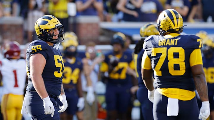 ANN ARBOR, MI - SEPTEMBER 21: Michigan Wolverines defensive lineman Mason Graham (55) talks to defensive lineman Kenneth Grant (78) before a play during a college football game against the USC Trojans on September 21, 2024 at Michigan Stadium in Ann Arbor, Michigan.