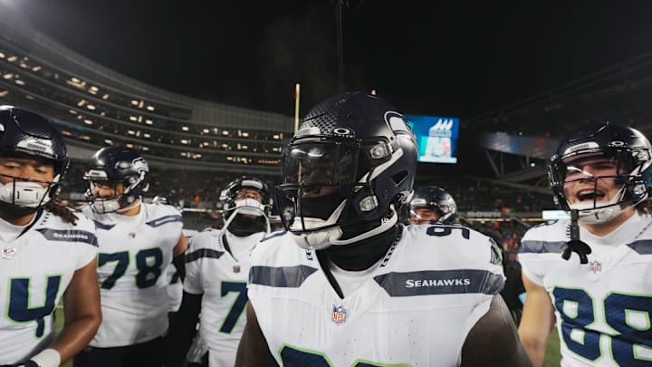CHICAGO, ILLINOIS - DECEMBER 26: Defensive tackle Jarran Reed #90 of the Seattle Seahawks gets hyped in a huddle prior to an NFL football game against the Chicago Bears, at Soldier Field on December 26, 2024 in Chicago, Illinois.