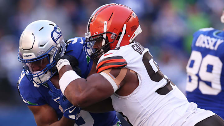 SEATTLE, WASHINGTON - OCTOBER 29: Myles Garrett #95 of the Cleveland Browns tackles Kenneth Walker III #9 of the Seattle Seahawks during the third quarter at Lumen Field on October 29, 2023 in Seattle, Washington. SEATTLE, WASHINGTON - OCTOBER 29: Myles Garrett #95 of the Cleveland Browns tackles Kenneth Walker III #9 of the Seattle Seahawks during the third quarter at Lumen Field on October 29, 2023 in Seattle, Washington.
