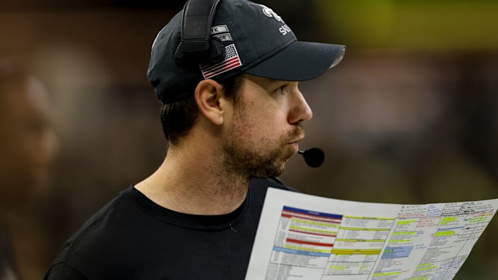 NEW ORLEANS, LOUISIANA - DECEMBER 1: Klint Kubiak, offensive coordinator for the New Orleans Saints, calls a play from the sideline during the second half of a game against the Los Angeles Rams at the Caesars Superdome on December 1, 2024 in New Orleans, Louisiana.