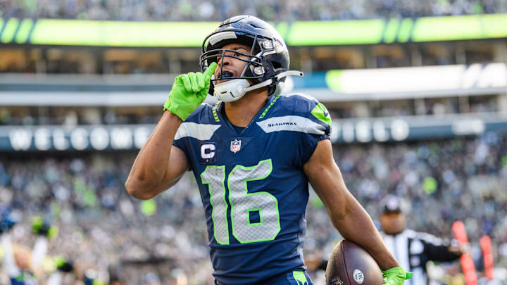 SEATTLE, WASHINGTON - NOVEMBER 27: Tyler Lockett #16 of the Seattle Seahawks celebrates during the first half of the game against the Las Vegas Raiders at Lumen Field on November 27, 2022 in Seattle, Washington.