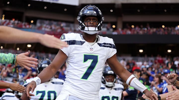 GLENDALE, ARIZONA - DECEMBER 08: Geno Smith #7 of the Seattle Seahawks takes to the field before the game against the Arizona Cardinals at State Farm Stadium on December 08, 2024 in Glendale, Arizona. GLENDALE, ARIZONA - DECEMBER 08: Geno Smith #7 of the Seattle Seahawks takes to the field before the game against the Arizona Cardinals at State Farm Stadium on December 08, 2024 in Glendale, Arizona.
