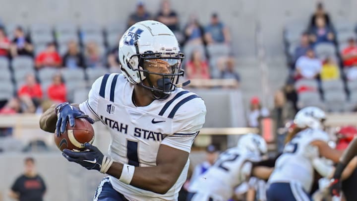 SAN DIEGO, CA - NOVEMBER 04: Utah State Aggies wide receiver Jalen Royals (1) runs with the ball during a game between the Utah State Aggies and the San Diego State Aztecs on November 04, 2023, at Snapdragon Stadium in San Diego, CA.