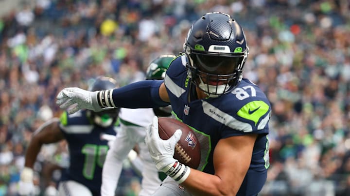 SEATTLE, WASHINGTON - JANUARY 01: Noah Fant #87 of the Seattle Seahawks runs the ball after a catch during the first quarter in the game against the New York Jets at Lumen Field on January 01, 2023 in Seattle, Washington. 