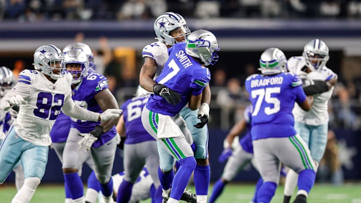 ARLINGTON, TX - NOVEMBER 30: Dallas Cowboys linebacker Micah Parsons (11) pressures Seattle Seahawks quarterback Geno Smith (7) during the game between the Dallas Cowboys and the Seattle Seahawks on November 30, 2023 at AT&T Stadium in Arlington, Texas.